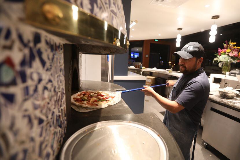 Isai Rios makes a pizza at Partenope in Richardson, which opened in November 2023.