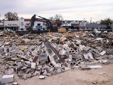 Six buildings in Snider Plaza were bulldozed on Monday. The University Park businesses inside them included now-closed Peggy Sue BBQ, Stella Nova coffee shop, Logos Bookstore, Lane Florist and others. Developer Jim Strode has plans to build a three-story office building with restaurants on the ground floor.