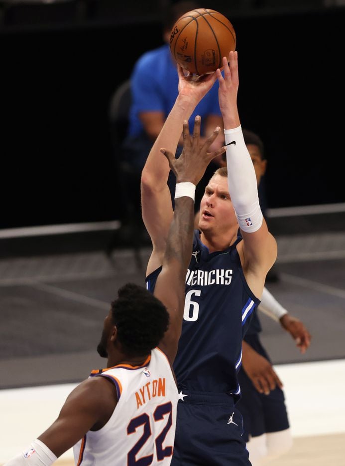 Dallas Mavericks forward Kristaps Porzingis (6) shoots over Phoenix Suns center Deandre...