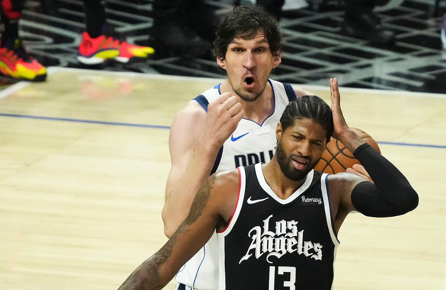 Dallas Mavericks center Boban Marjanovic (51) reacts after being called for a foul against...