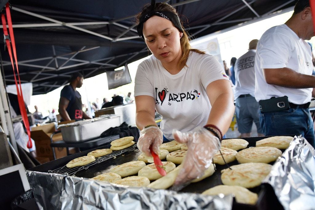 Pamela Lozano, 34, prepares arepas at her food booth Arepa Nation at the Dallas Farmers Market.