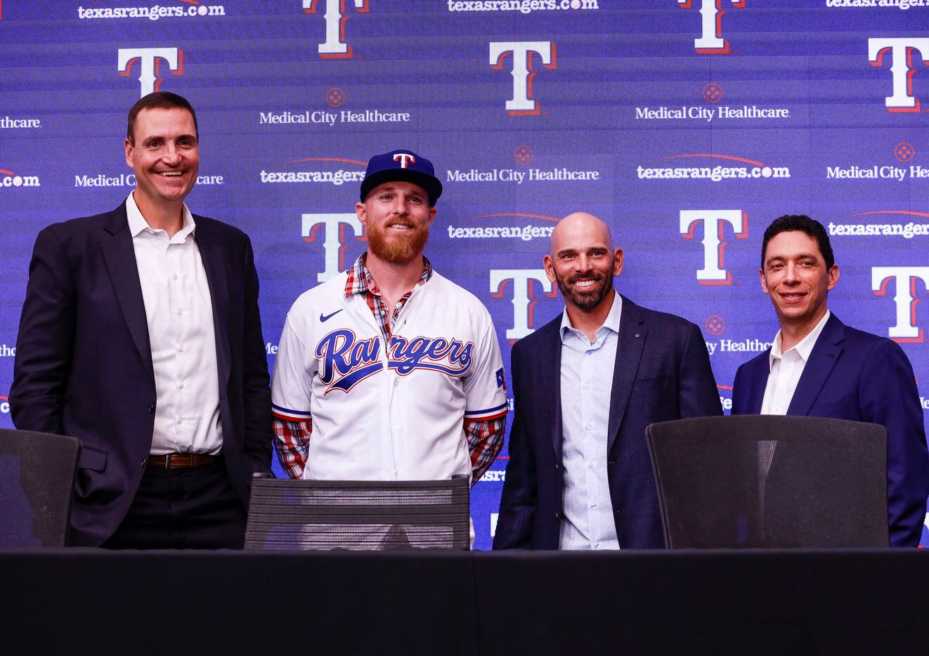 Chris Young, Jon Gray,Chris Woodward and Jon Daniels take a photo together a news conference at Globe Life Park in Arlington on Wednesday, Dec. 1, 2021. Former Colorado Rockies pitcher, Jon Gray, signed with the Texas Rangers for 56 million dollars. (Rebecca Slezak/The Dallas Morning News)