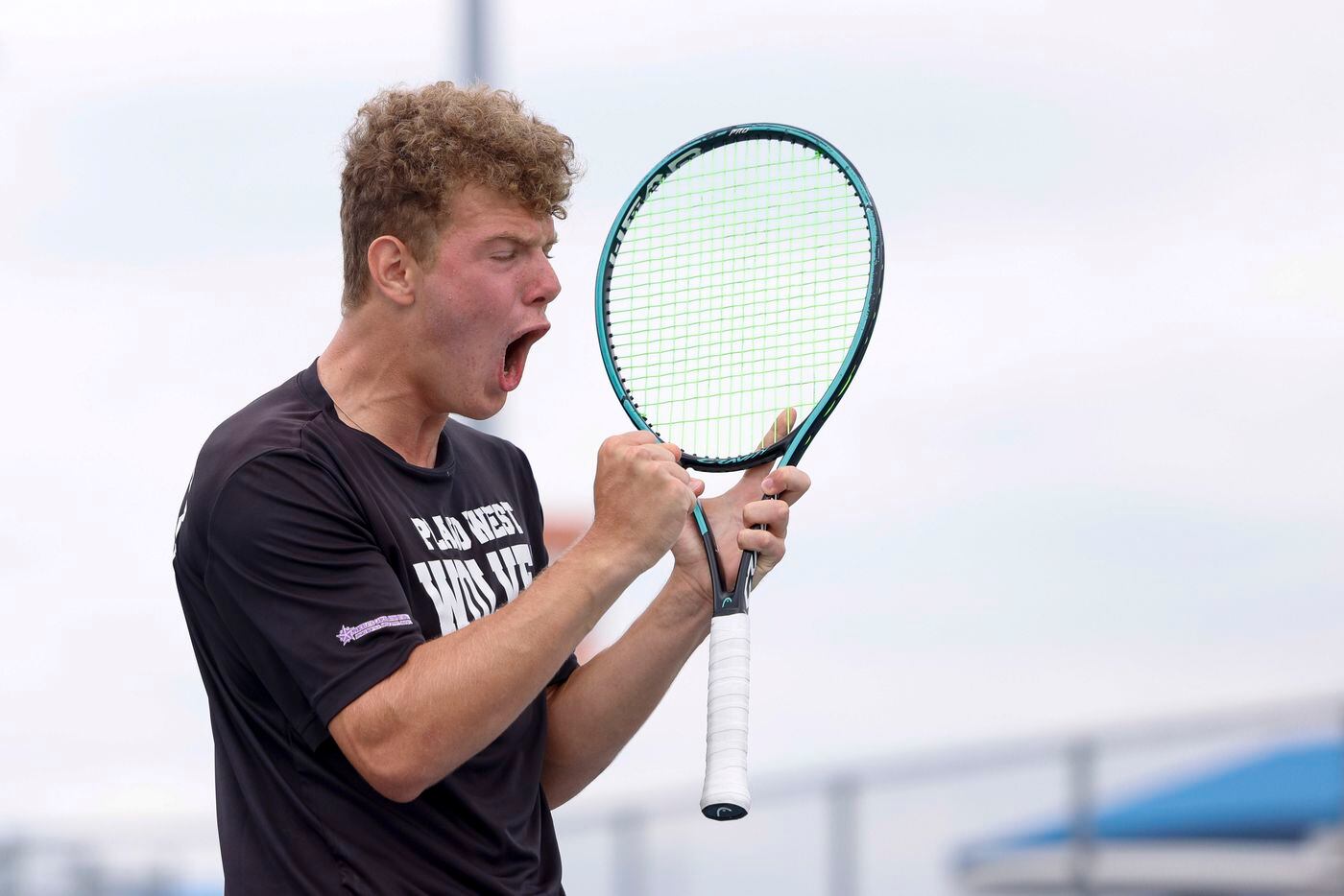 Plano West’s Dmitri Goubin celebrates a point during the 6A mixed doubles championship match...