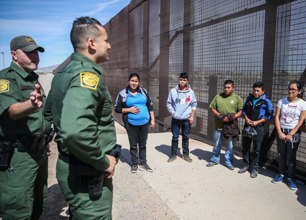 U.S. Border Patrol agents take into custody a group of Central American asylum seekers who...