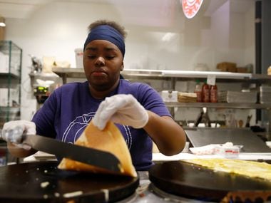 Alyce Jones works on turning a crepe over at Whisk & Eggs inside Legacy Hall in Plano.