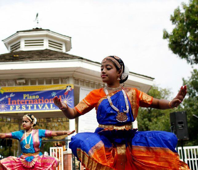 Members of the Kalarpan Bharatanatyam Dance School performs during the Plano International...