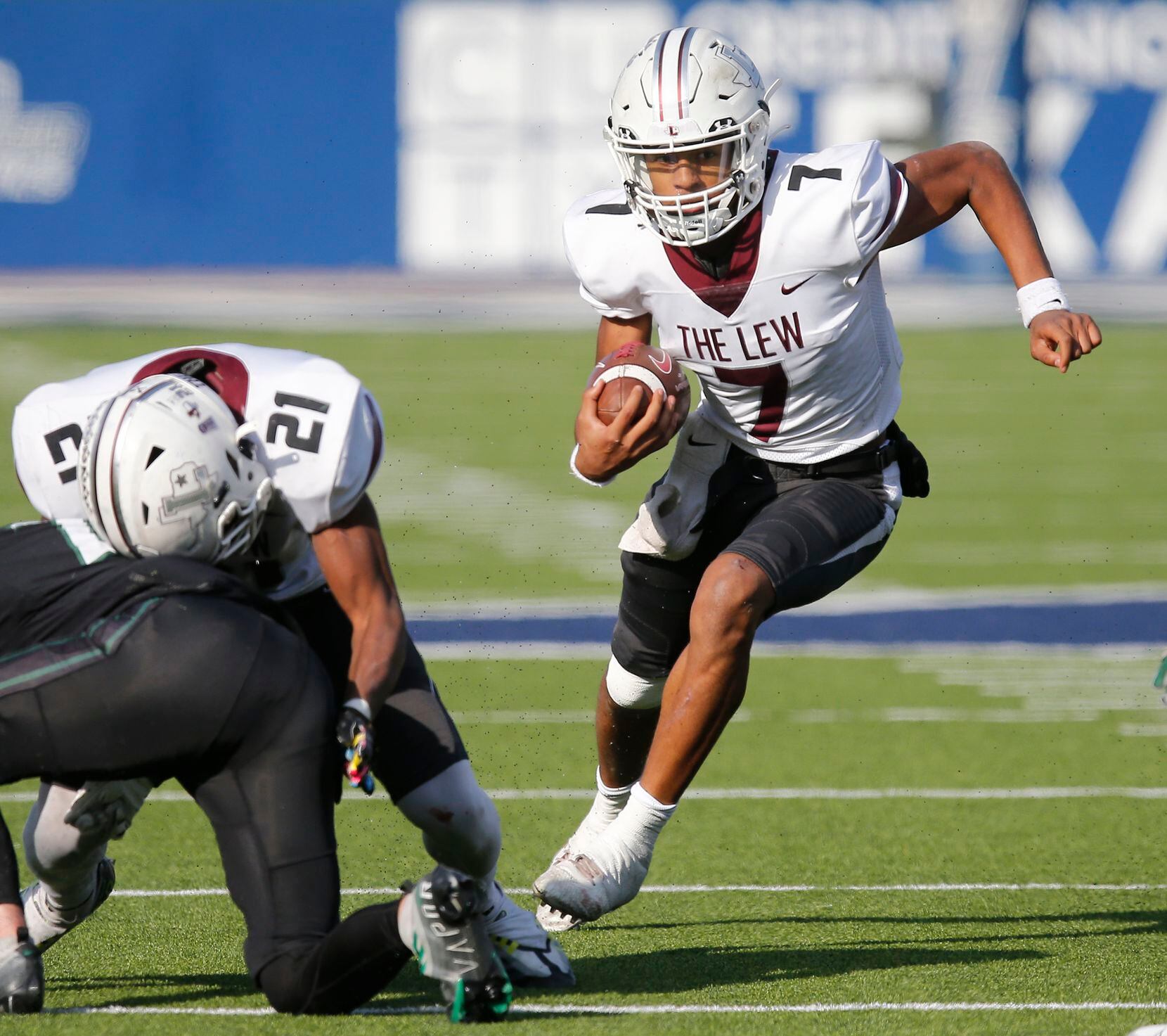 Lewisville High School quarterback Ethan Terrell (7) keeps the ball during the first half as...