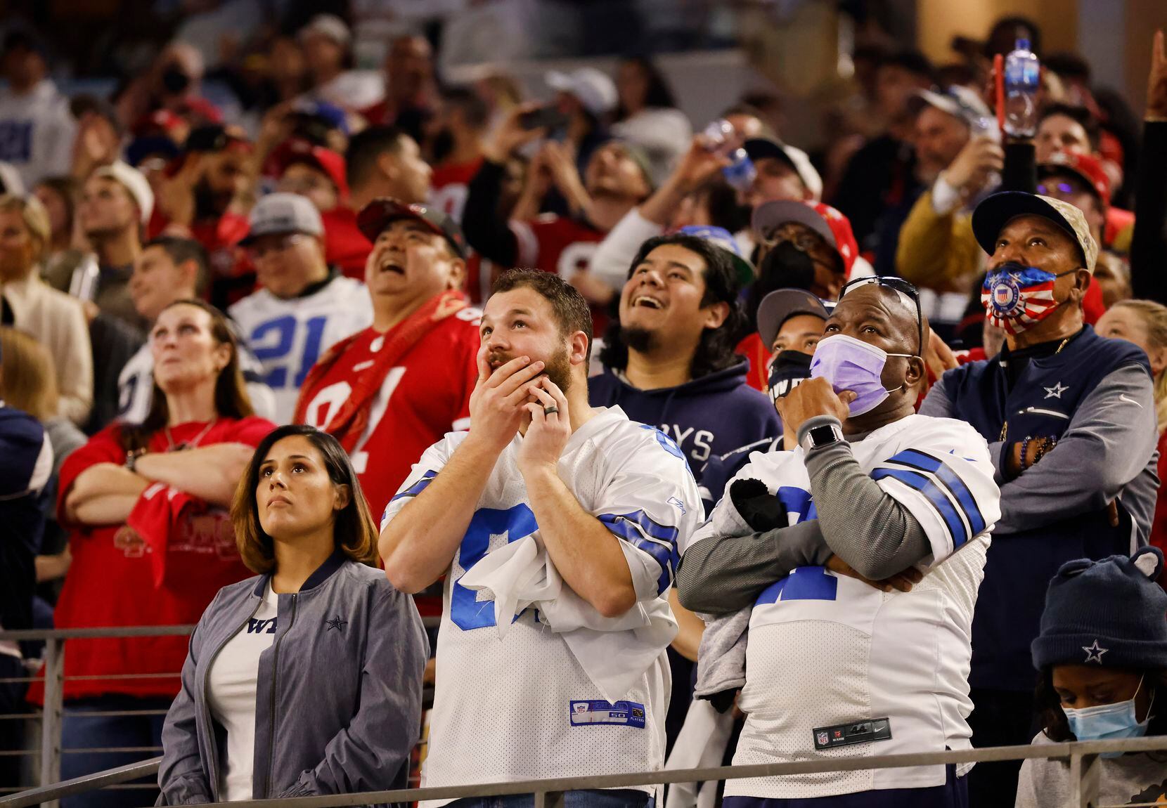 Dallas Cowboys and San Francisco 49ers fans wait patiently to hear whether San Francisco...