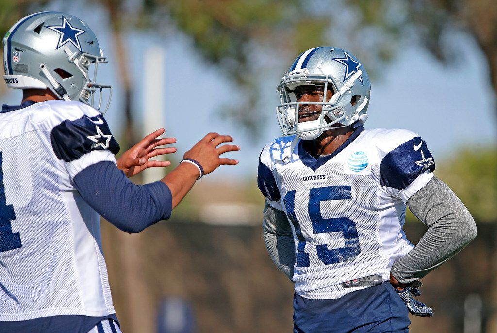 Cowboys wide receiver Deonte Thompson (15) talks with quarterback Dak Prescott during an...