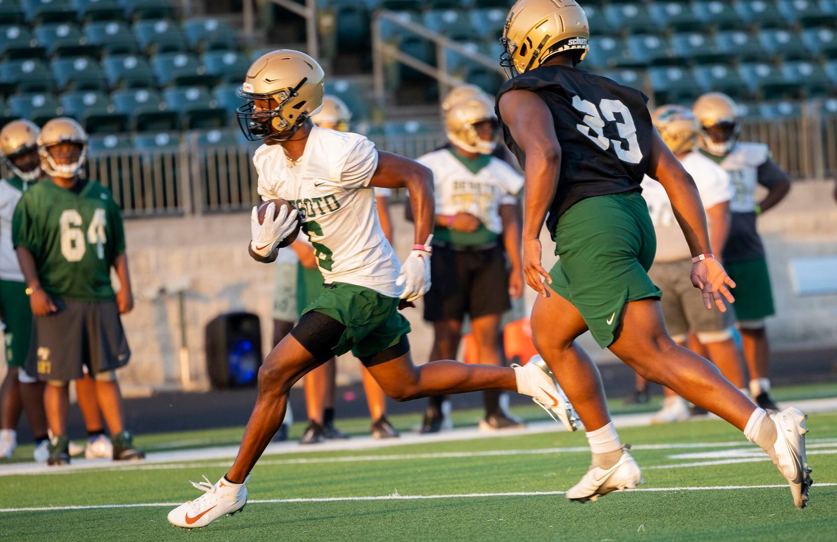 DeSoto running back Tre Wisner runs the ball during a play with his team during the first...