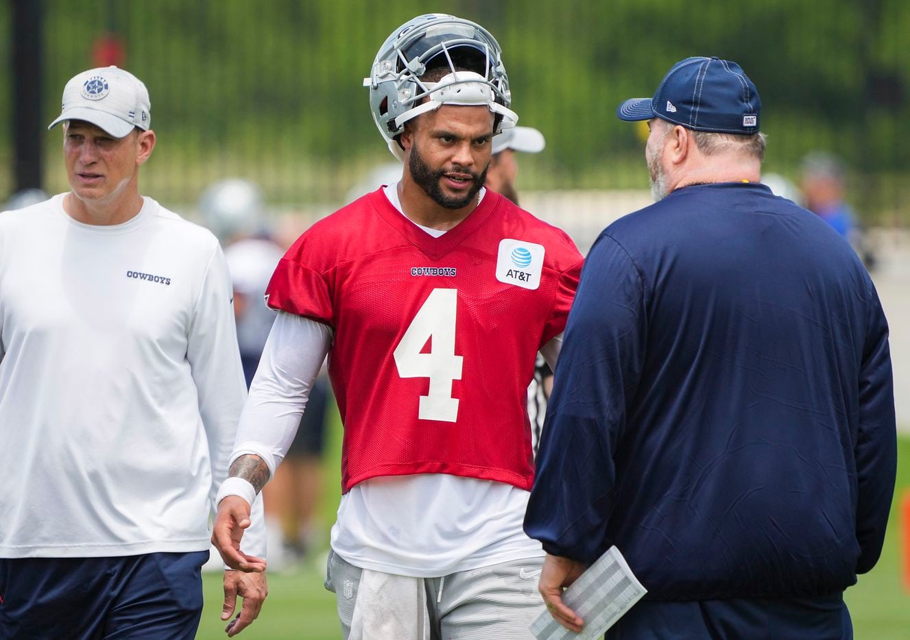Dallas Cowboys quarterback Dak Prescott (4) talks with head coach Mike McCarthy (right) during a minicamp practice at The Star on Tuesday, June 8, 2021, in Frisco. Quarterbacks coach Doug Nussmeier is at left. Smiley N. Pool/The Dallas Morning News)