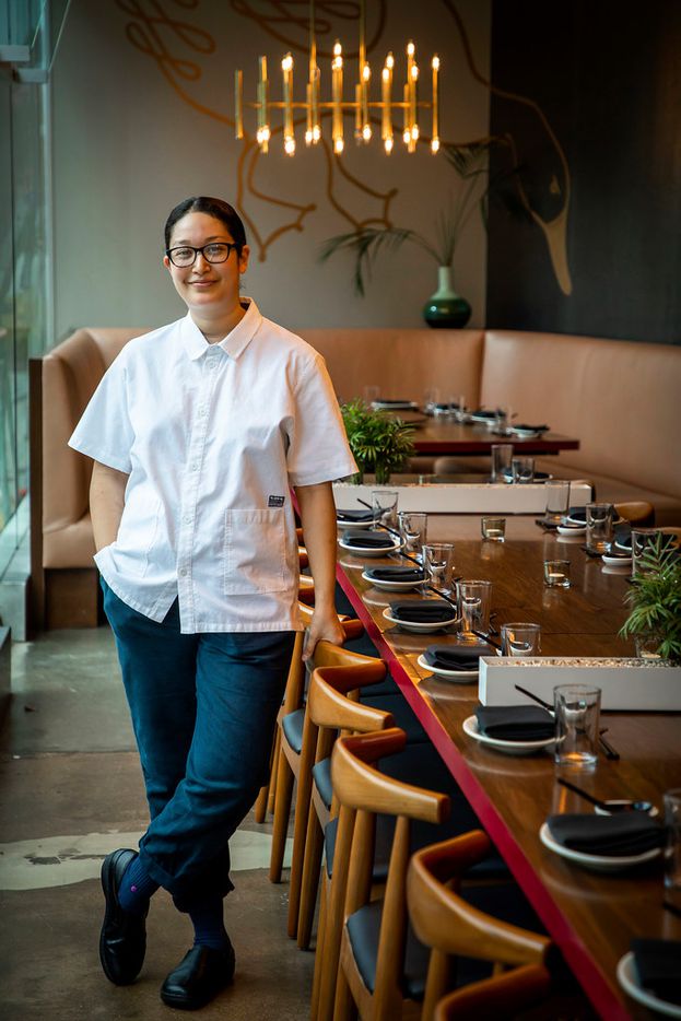 Executive chef Angela Hernandez stands at the long, 28-seat table at Fine China in Dallas.