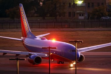 A Southwest Airlines jet taxis to the terminal at Dallas Love Field, Thursday, October 17,...