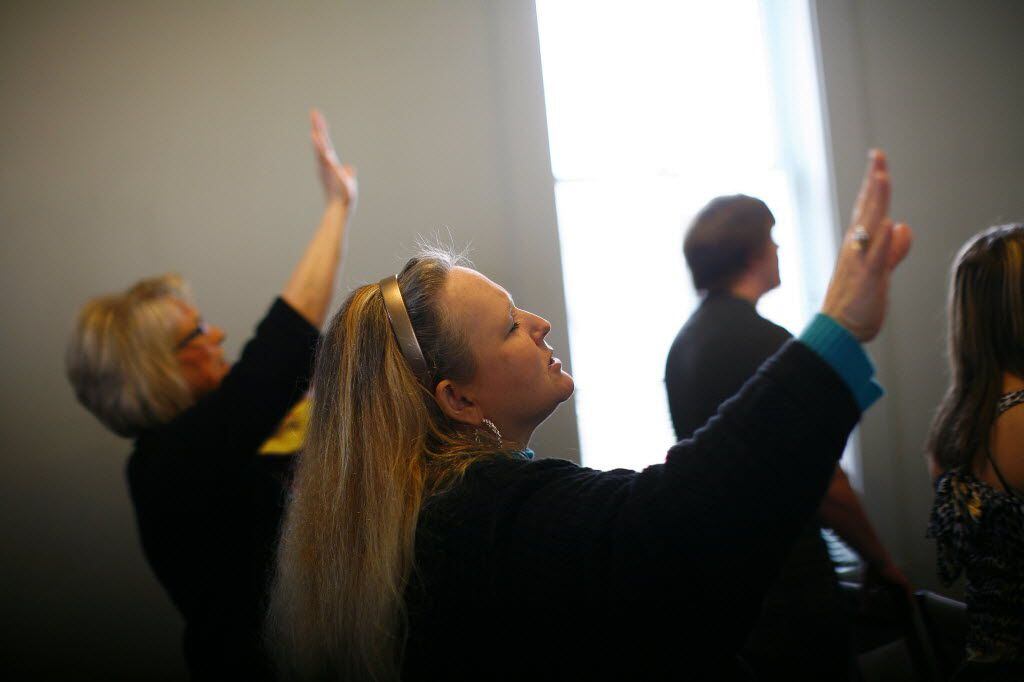 Members worship at The Rock Christian Life Center, an evangelical Christian church, in...