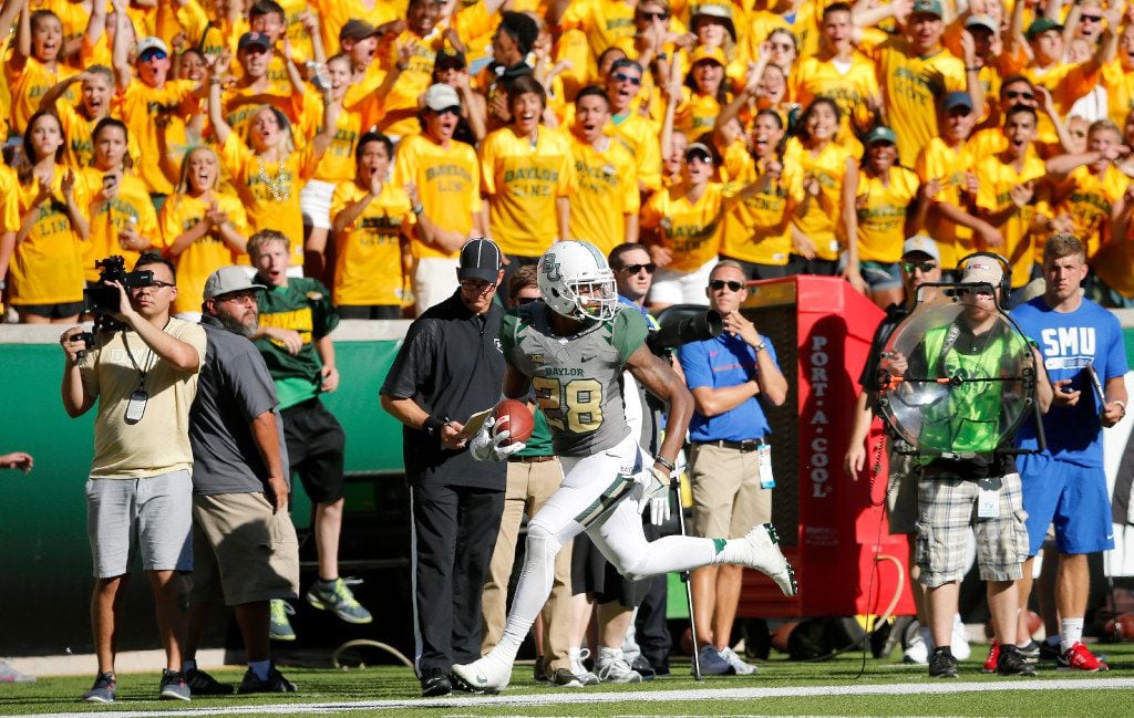 Baylor safety Orion Stewart (28) returns an interception for a touchdown during the third...