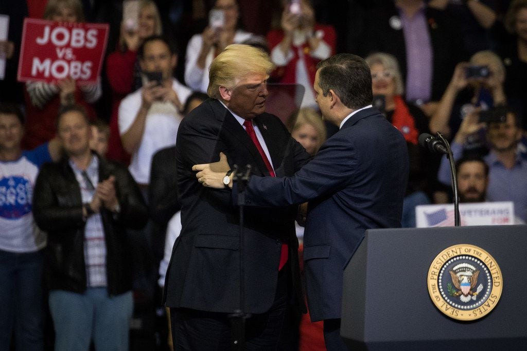 President Donald Trump is brought on stage by Sen. Ted Cruz during a rally on October 22, 2018 at the Toyota Center in Houston. Cruz is seeking re-election in a high-profile race against Democratic challenger Beto O'Rourke.