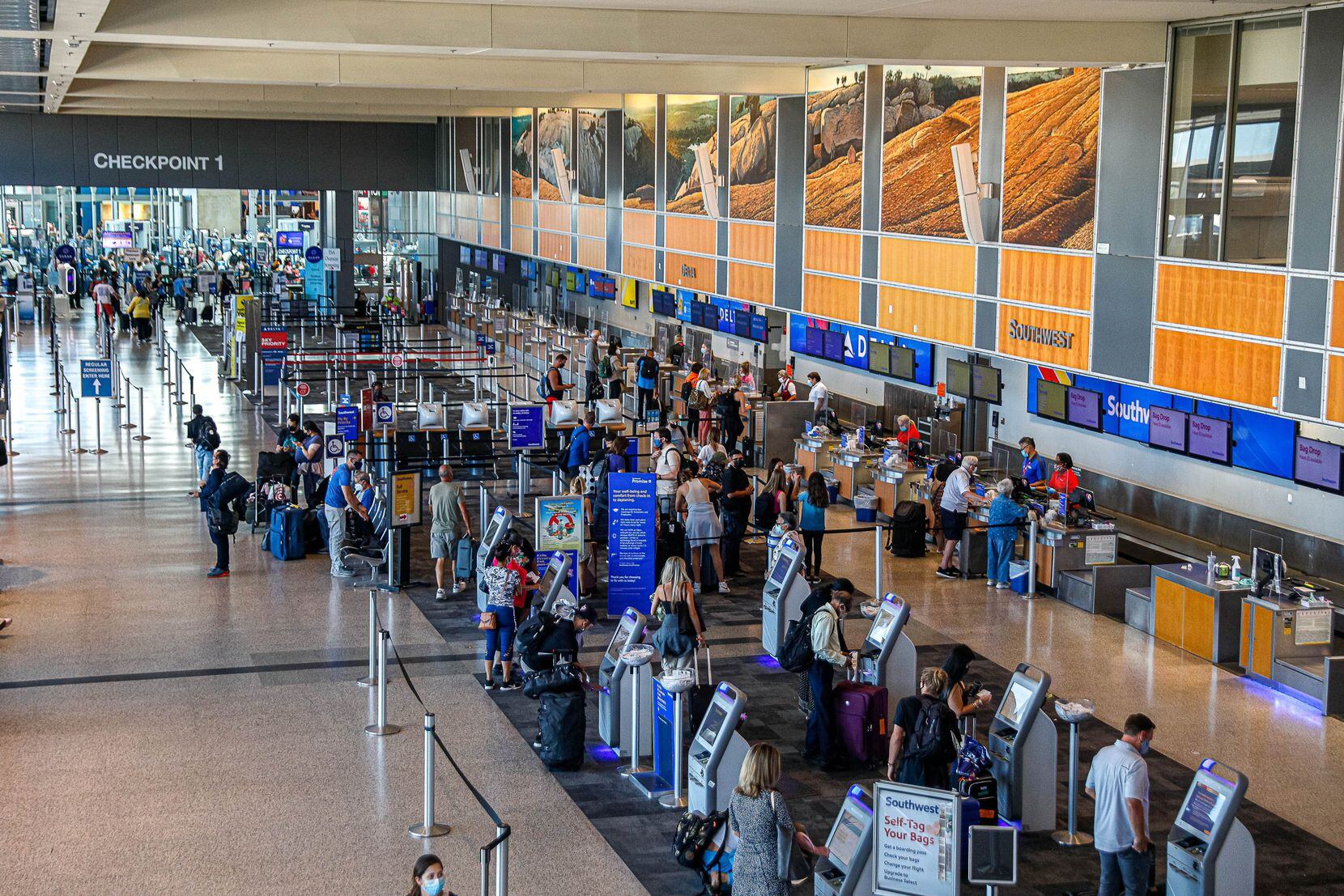 Travelers filled the lines at Southwest Airlines counters at Austin-Bergstrom International...