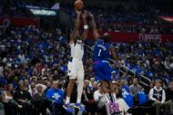 Dallas Mavericks forward P.J. Washington (25) shoots against LA Clippers guard James Harden...