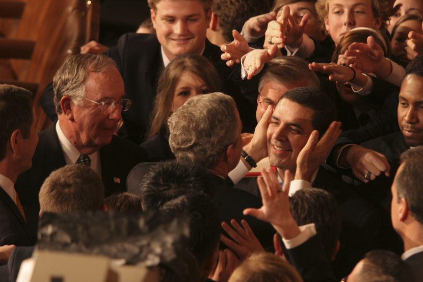 President George W. Bush embraces Rep. Henry Cuellar, D-Laredo, at the State of the Union...