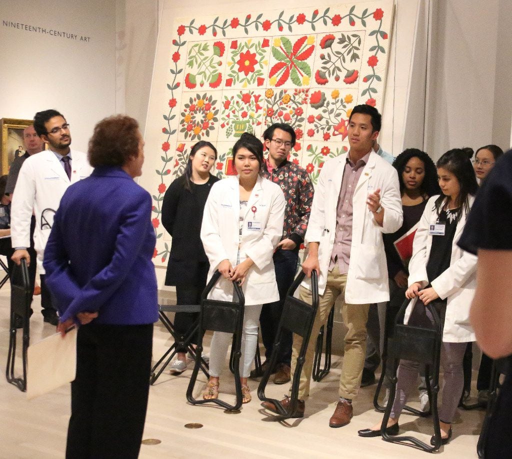 Bonnie Pitman of UT Dallas talks with UT Southwestern Medical School students about items at the Dallas Museum of Art, in a program called "Art of Examination," which explores ways in which the DMA's collections can help students improve their observation/diagnostic skills as future doctors. 