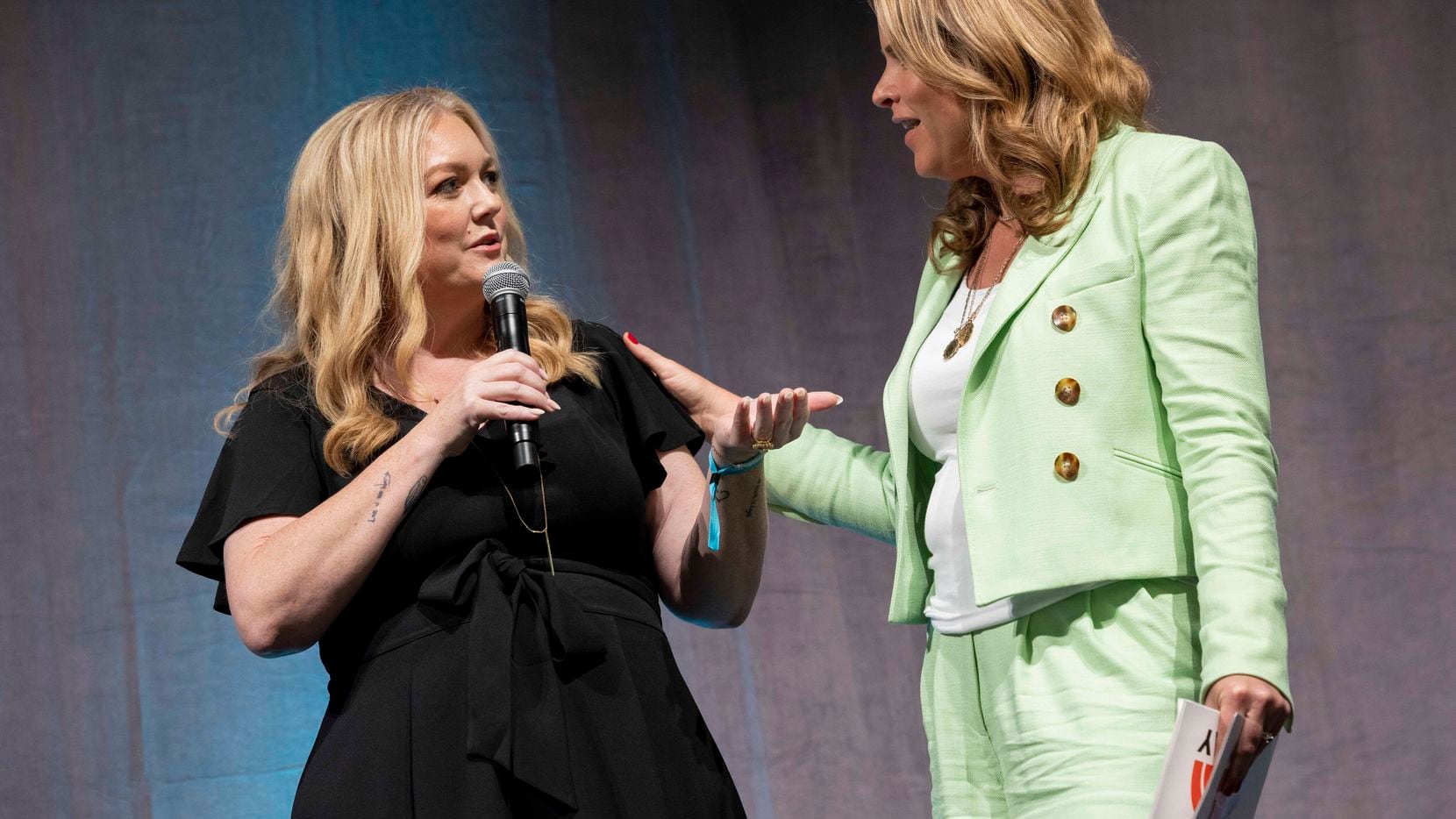 Author Colleen Hoover and "Today Show" co-host Jenna Bush Hager chat onstage before a panel...