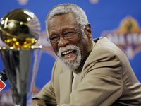 FILE - NBA great Bill Russell reacts at a news conference as he learns the most valuable...
