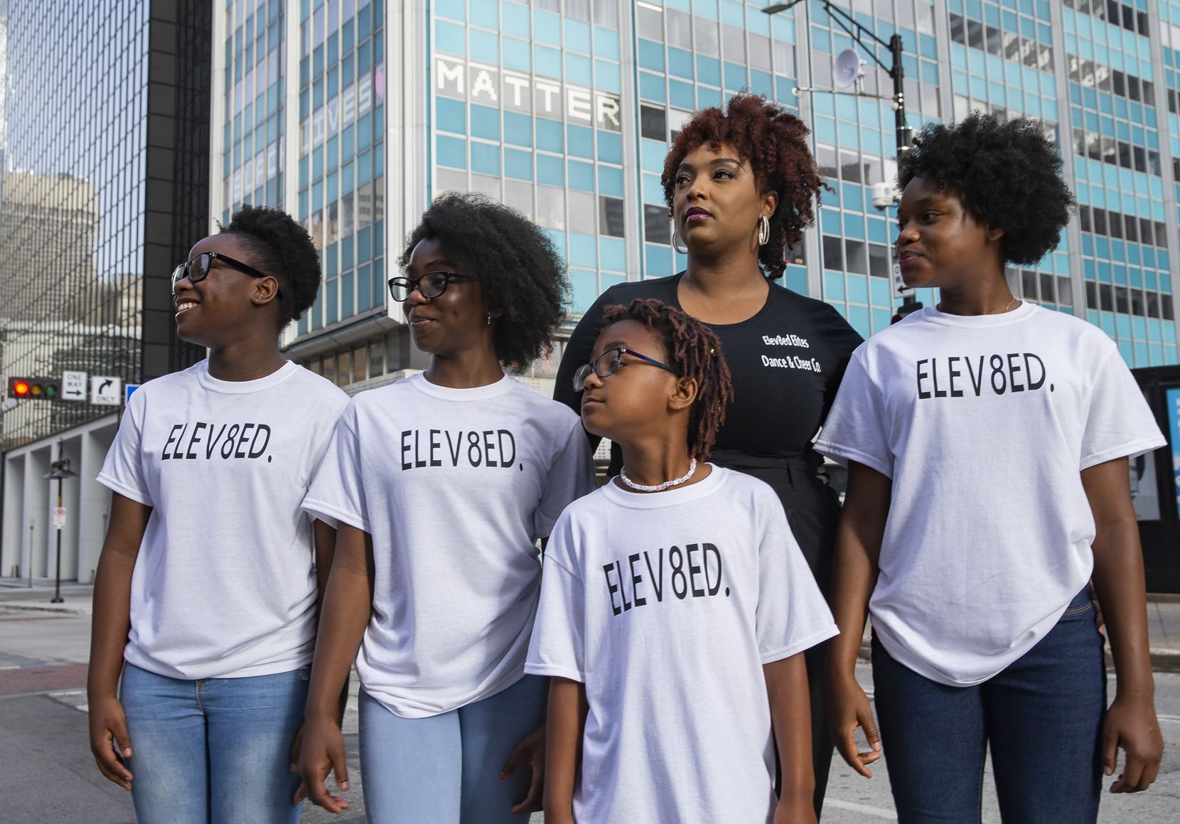(From left) Members of Elev8ed Elites, Janyiah Cooks, 12, Zaria Fisher, 10, Arianna Roberts, 7, dance director Shantrail White and co-captain Sha'kyra Roberts, 13, pose for a photo on June 27, 2020 in Dallas. Elev8ed Elites is an all girls dance team that shot a video downtown in response to police brutality shortly after George Floyd died. (Juan Figueroa/ The Dallas Morning News)