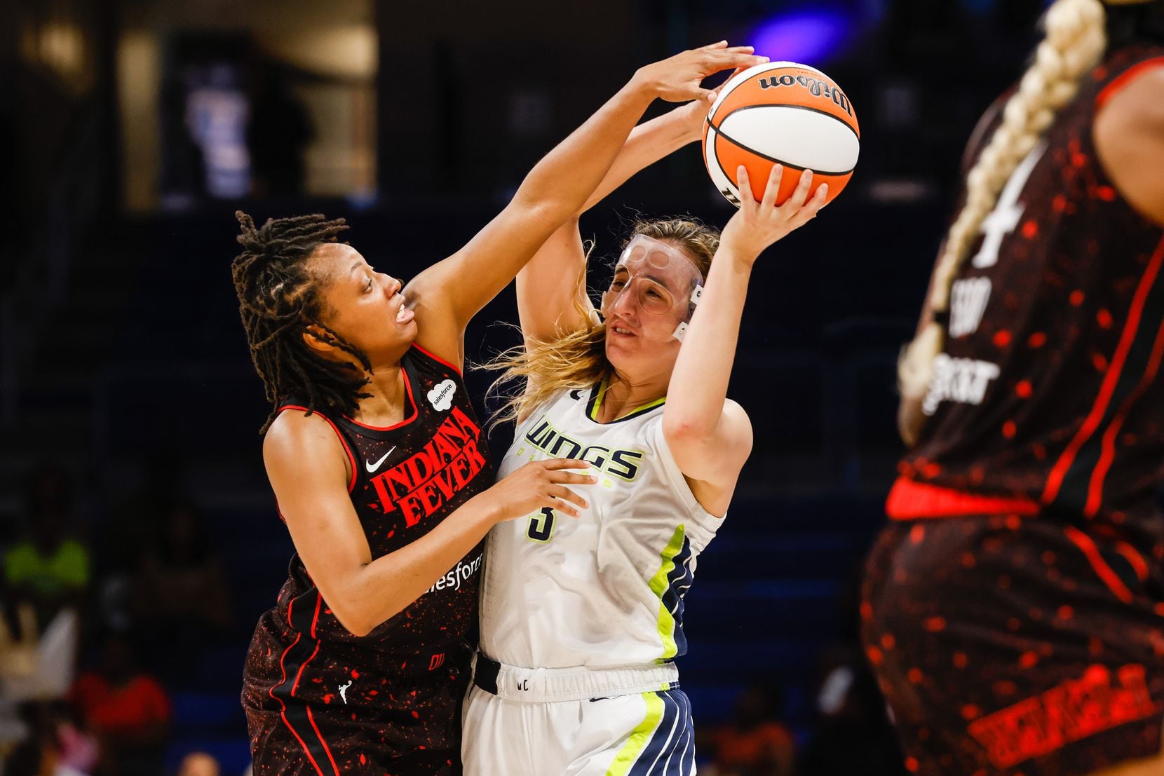 Dallas Wings guard Marina Mabrey (3) tries to make a pass as Indiana Fever guard Kelsey...