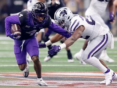 TCU Horned Frogs wide receiver Taye Barber (4) pushes off Kansas State Wildcats linebacker...