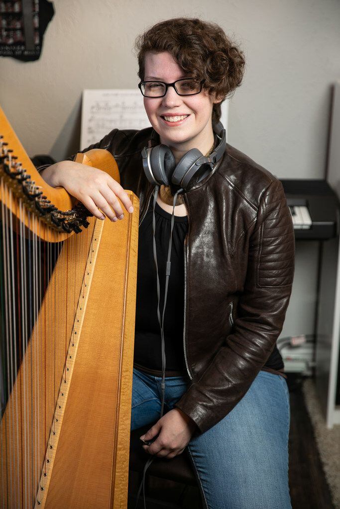 Portrait of Kimberley Osberg with her harp at her Dallas home. 