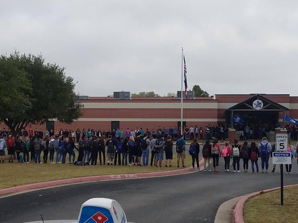 Students from the Ninth Grade Campus gathered outside the school to pray for Aaron Singleton...