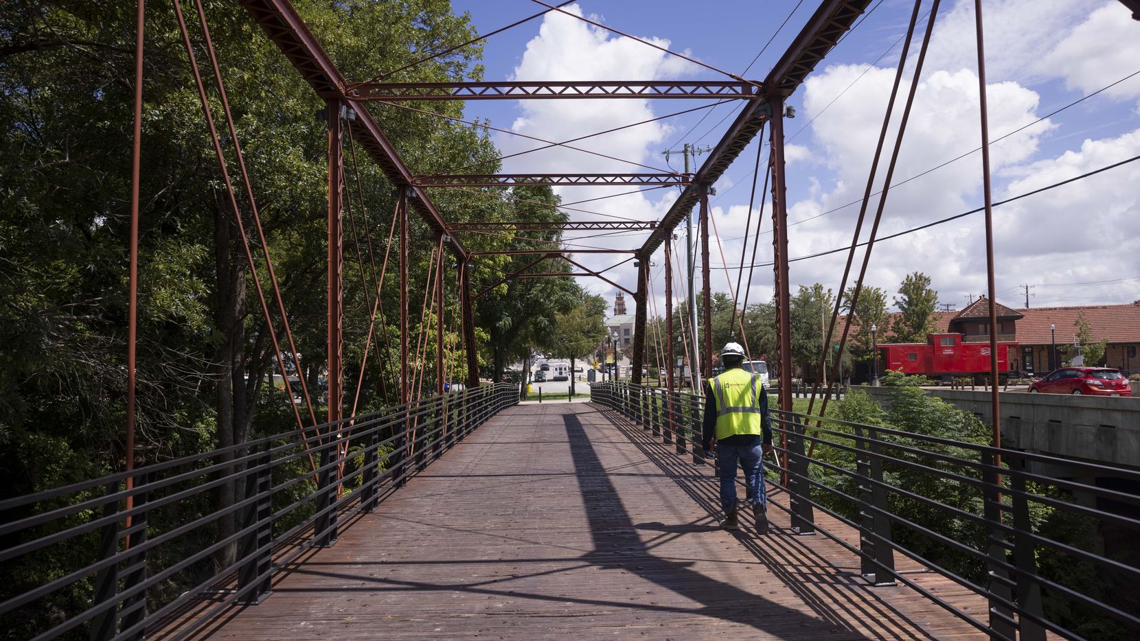 A construction worker walks across the historic Rogers Street Bridge on Monday, Aug. 29,...