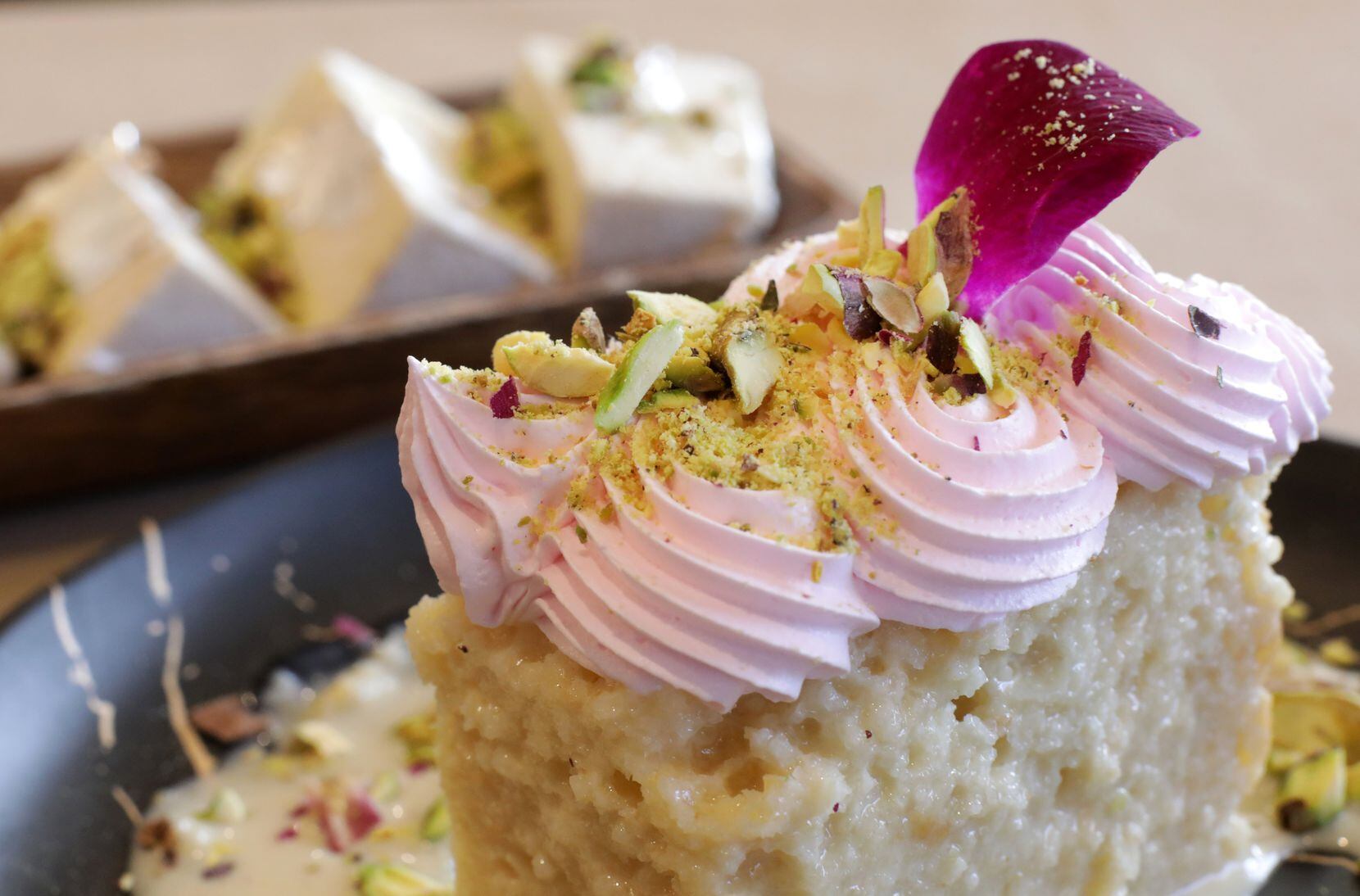 The Rasmalai Gateau, foreground, and Mughlai Kulfi are served at Minerva Indian Bistro in...