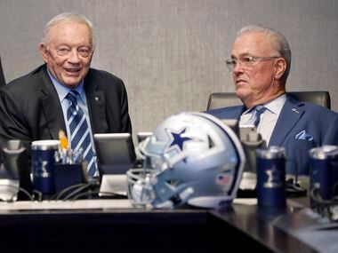 Dallas Cowboys owner Jerry Jones (left) visits with executive vice president & CEO Stephen...