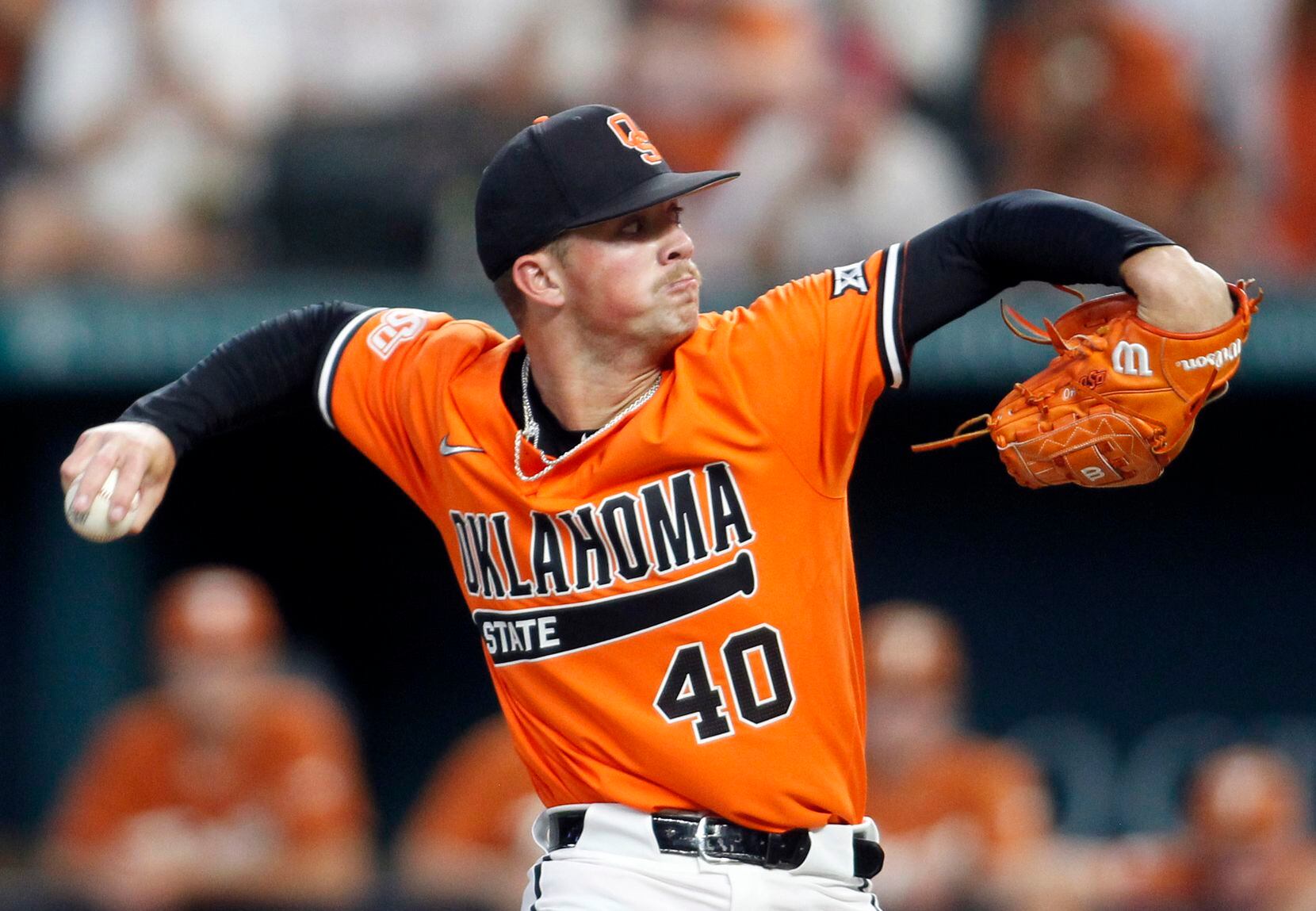 Oklahoma State pitcher Kale Davis (40) delivers a pitch to a Texas Longhorns batter during...