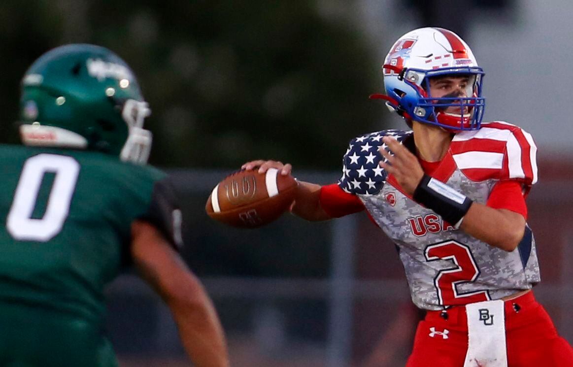 Midlothian Heritage quarterback Kaden Brown (2) launches a pass downfield as Kennedale...