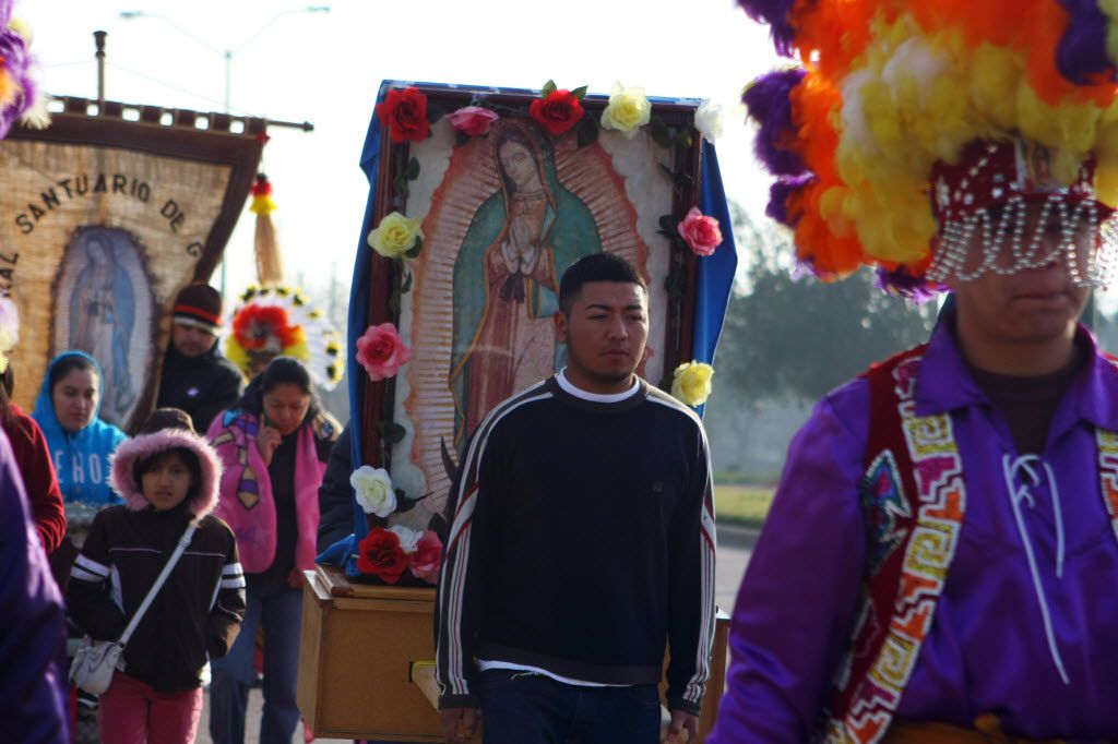 Ramiro Lopez, 29, carries an image of Our Lady of Guadalupe during the Pastoral Juvenil's...