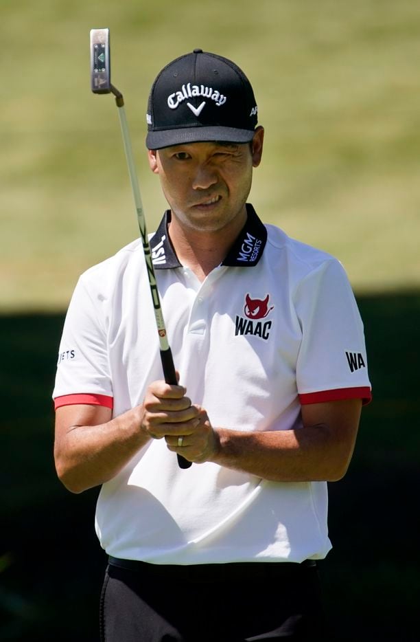PGA Tour golfer Kevin Na lines up his putt on the ninth green during the second round of the...