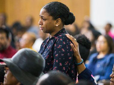 Cynthia Johnson, Botham Shem Jean's girlfriend,  is comforted by a fellow congregant during...