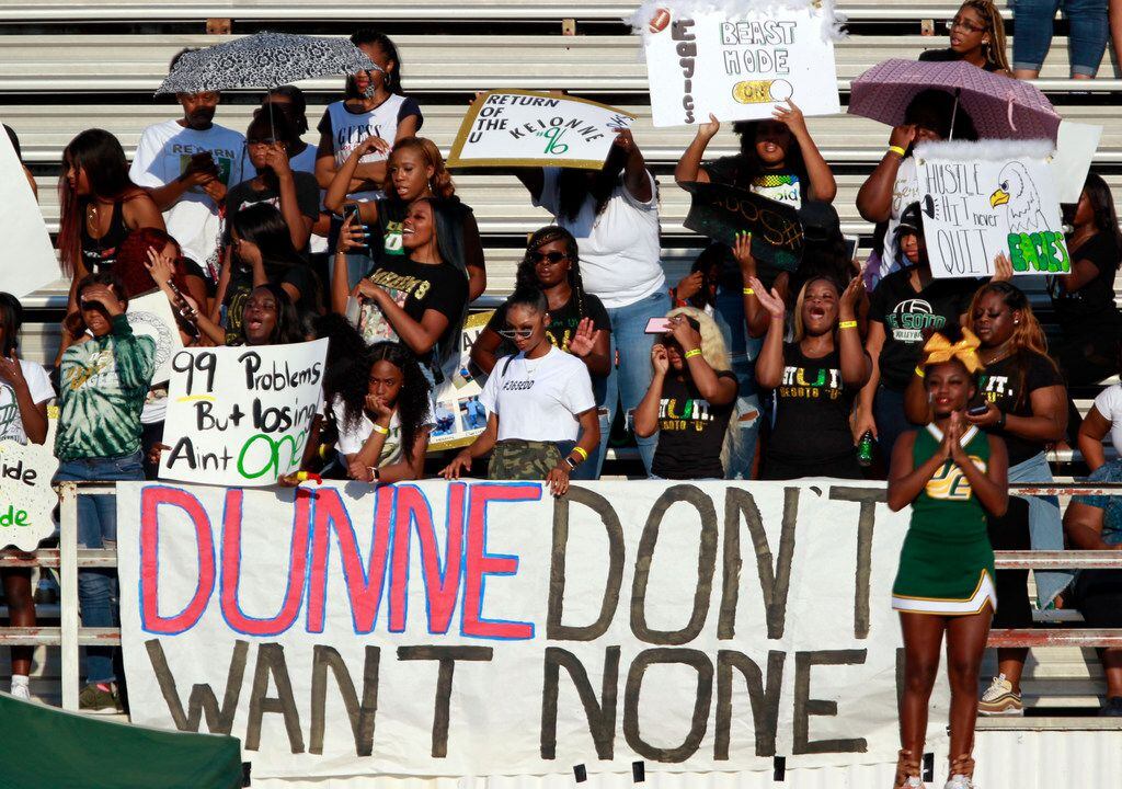 Desoto student fans display various emotions, and try to shield themselves from the hot sun early in the first half of their high school football game, the Lone Star Sports Football Classic,  at Sprague Stadium in Dallas on Saturday, September 14, 2019. (John F. Rhodes / Special Contributor)