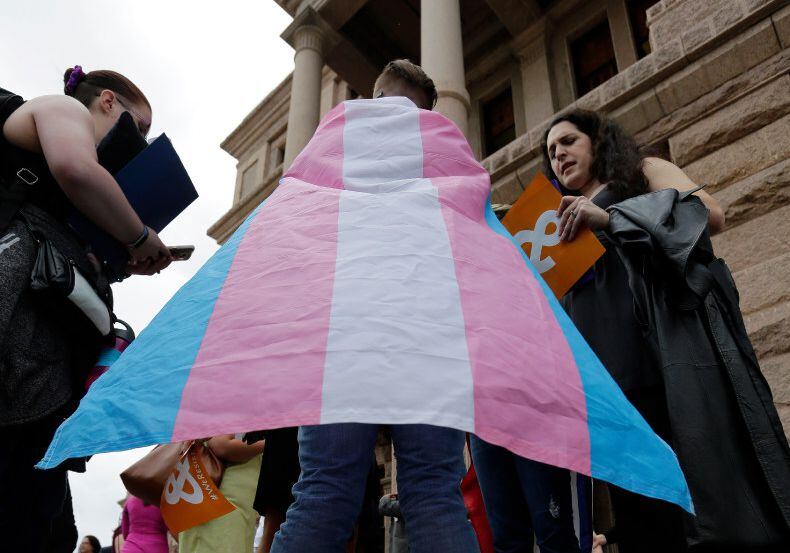 Members of the transgender community take part in a rally on the steps of the Texas Capitol...