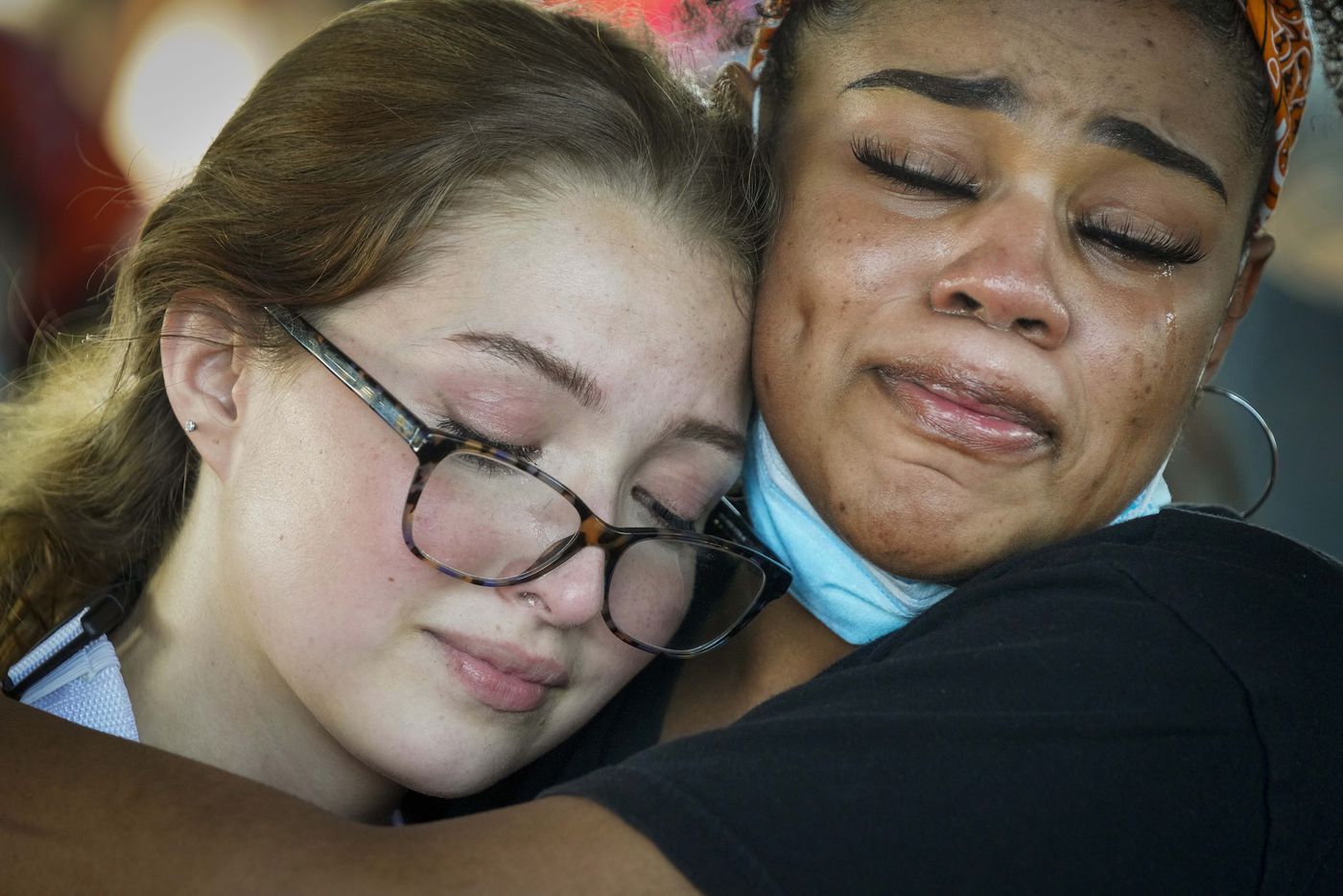 Tears stream down their cheeks as organizers Bela Marcano (left) and Monique Mitchell as they listen to a speaker during a protest organized by a group of Berkner High School students at Berner Park while protests continue after the death of George Floyd on Wednesday, June 3, 2020, in Richardson. (Smiley N. Pool/The Dallas Morning News)