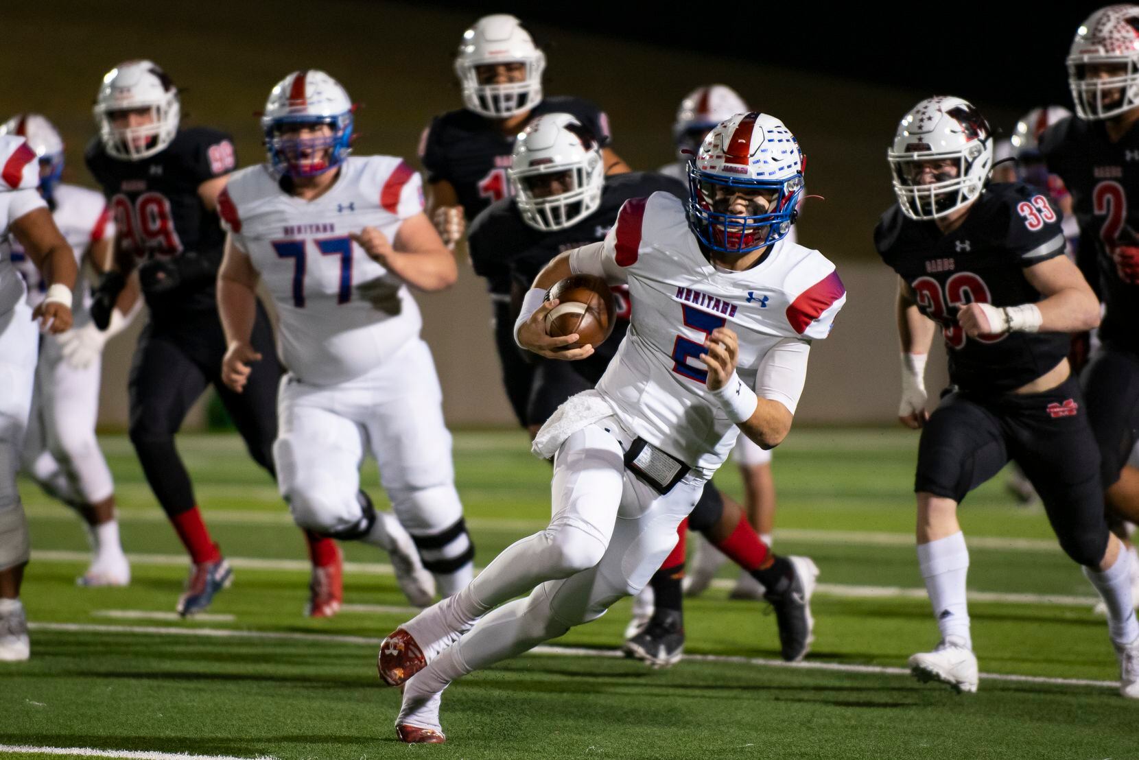 Midlothian Heritage junior Kaden Brown (2) looks to avoid a tackle after getting a first...