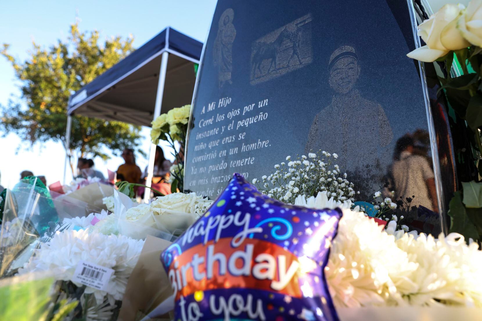 Flowers surround Xavier Gonzalez’s grave Sunday in Garland. 