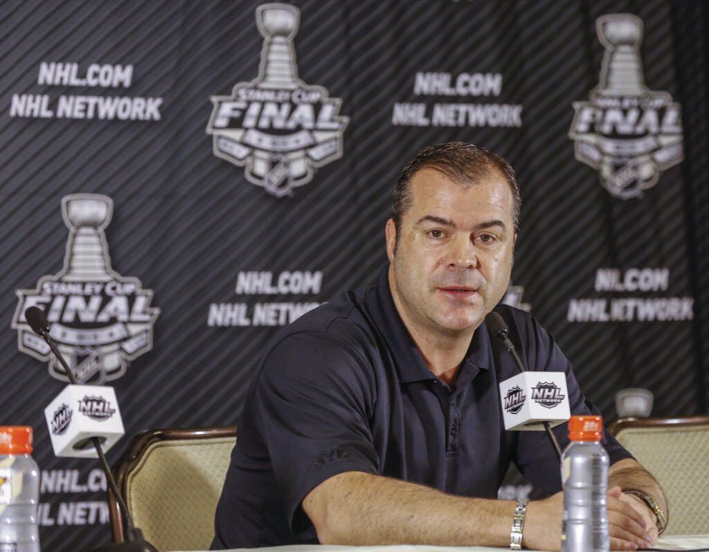 New York Rangers head coach Alain Vigneault takes questions from the media at a news...