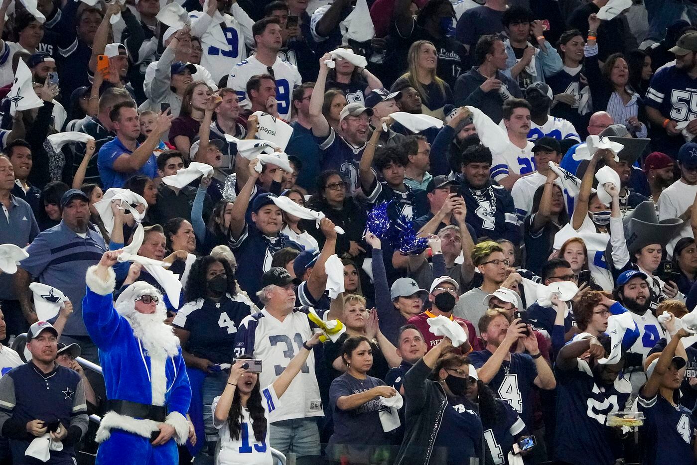 Dallas Cowboys fan cheer the opening kickoff during of an NFL football game against the...