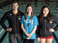 Panther Creek swimmer Aidan Eckard (left) stands with Panther Creek swim coach Megan Conner...