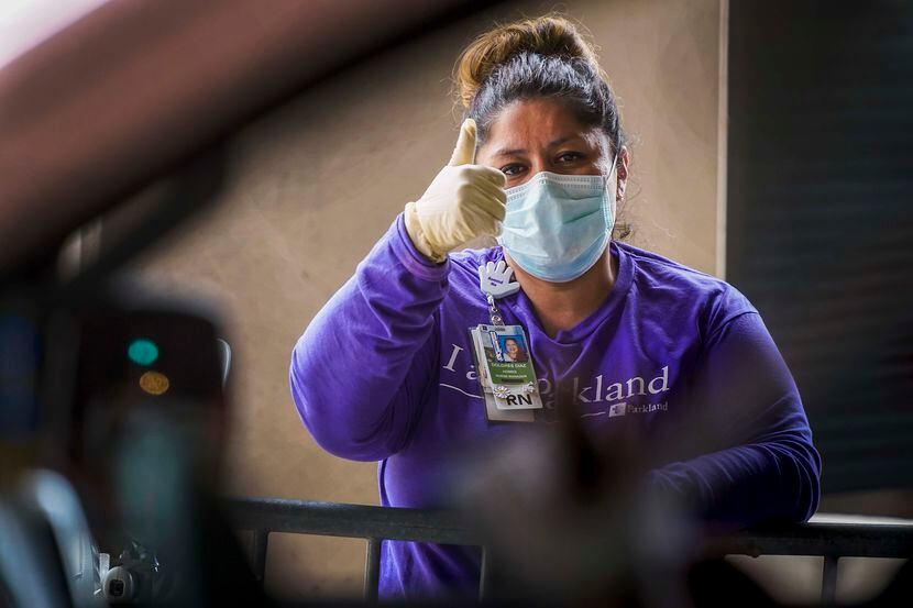 Parkland Homeless Outreach Medical Services (HOMES) program nurse manager Dolores Diaz gives...