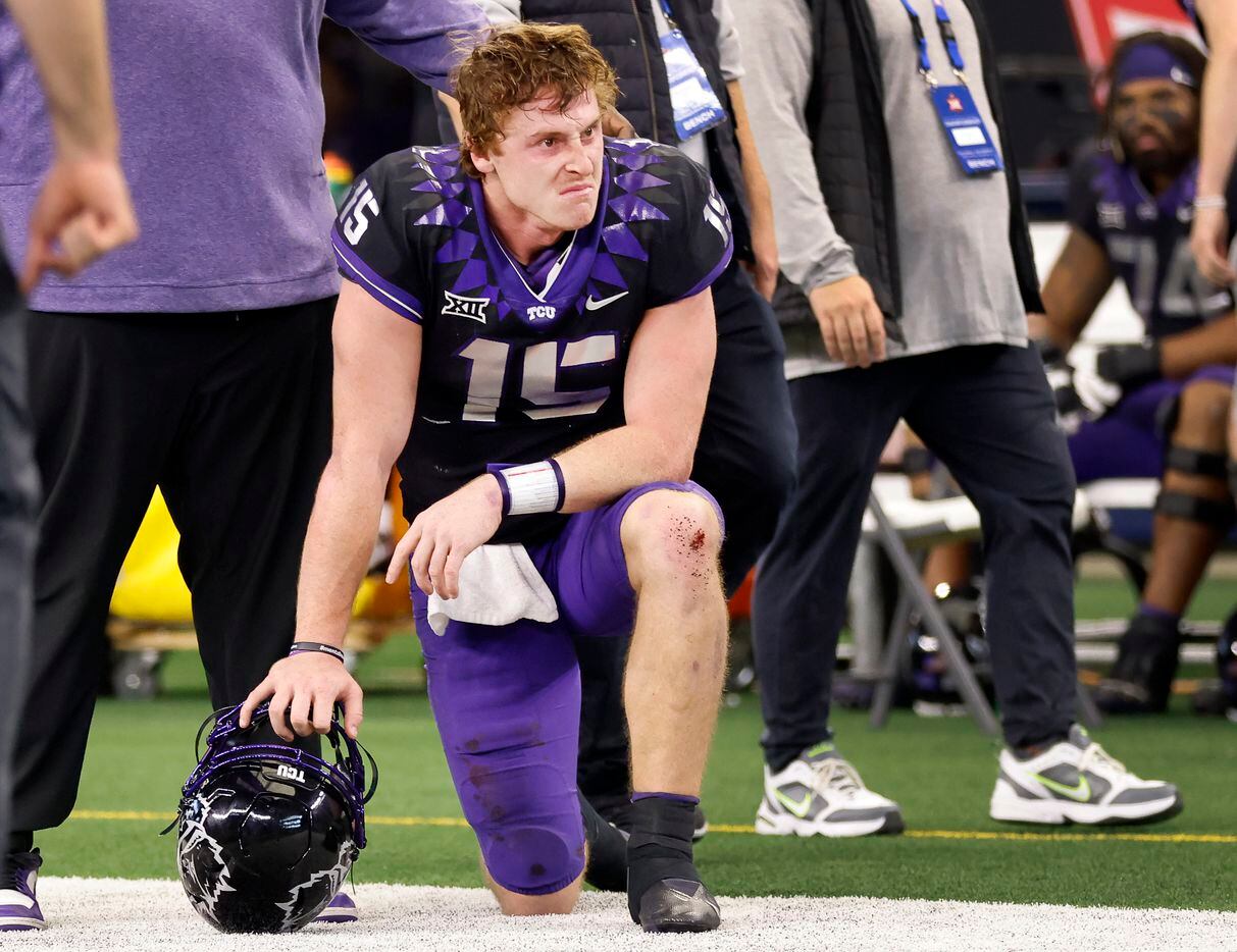 TCU Horned Frogs quarterback Max Duggan (15) takes a knee on the sideline after losing to...