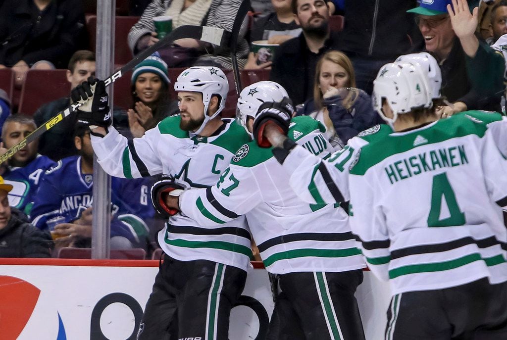 Dallas Stars' Jamie Benn (14) celebrates his goal against the Vancouver Canucks during the...